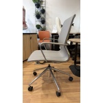 Side view of the Baye Leather Chair with padded leather seat, chrome frame, and rolling aluminium base.