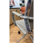 Close-up of the Baye Leather Chair featuring premium leather upholstery, chrome armrest, and polished aluminium frame.